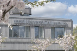 FU Berlin building with cherry trees in bloom